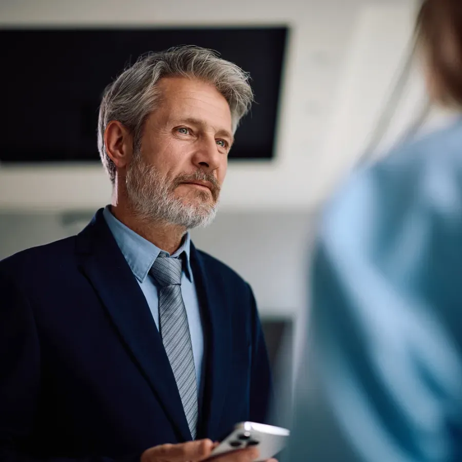 A provider in conversation with a colleague in an office